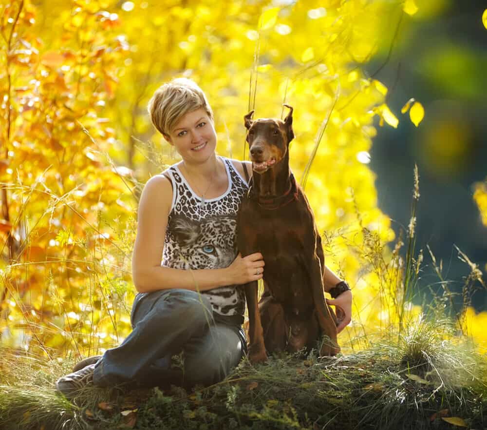 Woman with Loyal Doberman dog
