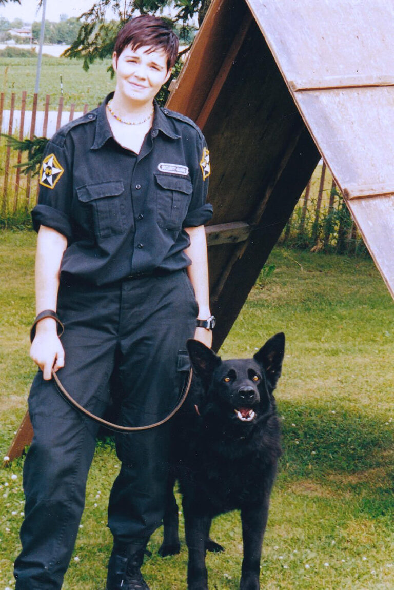 Security Guard with black dog at security dog training at TorontoK9Center.com