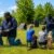 Board & Train vs weekly dog training lessons at Toronto K9 Center in Whitby showing Roger Richards working with a German Shepherd and leading a group dog training class.